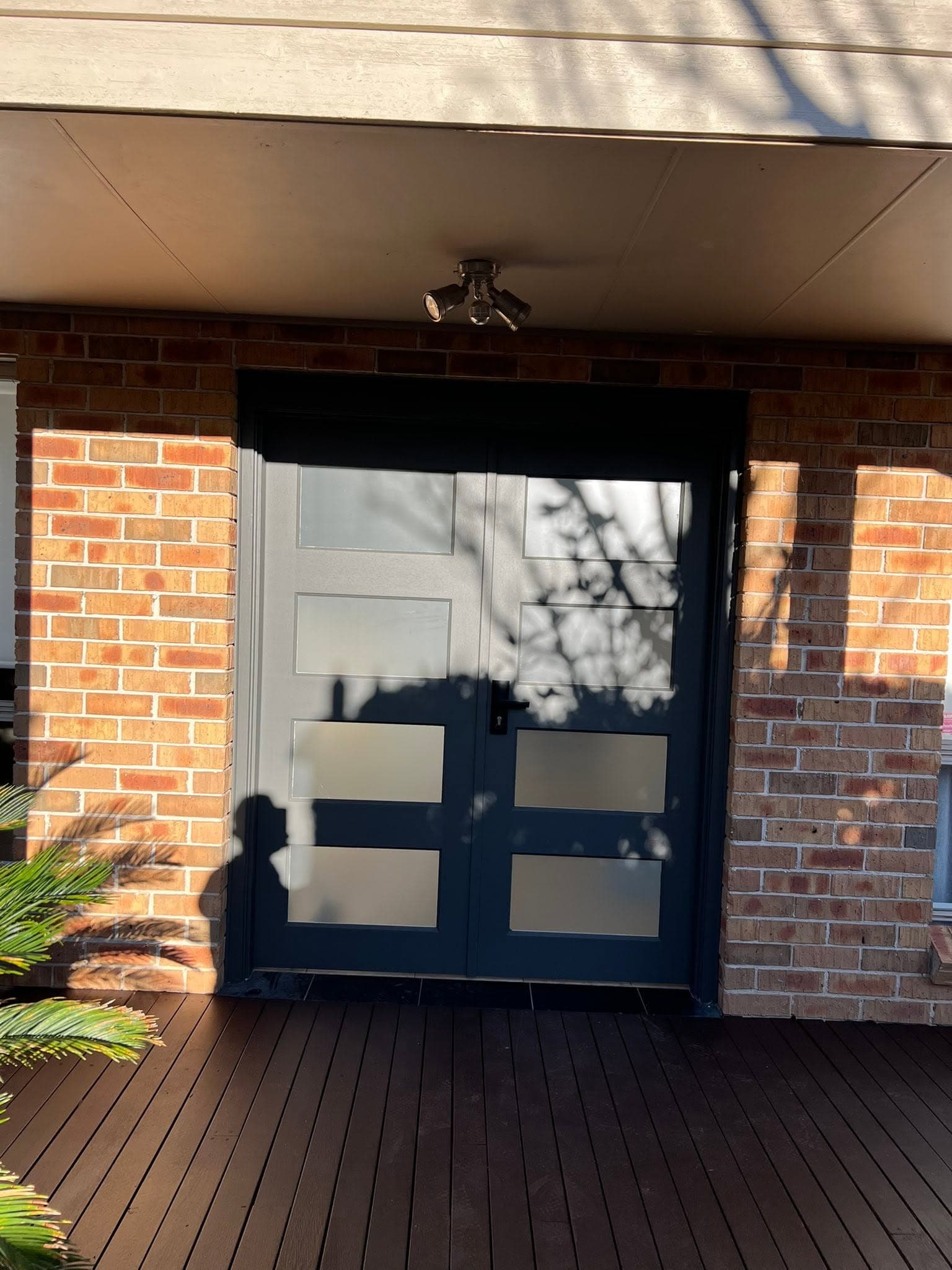 Navy double entry doors from the porch, installed